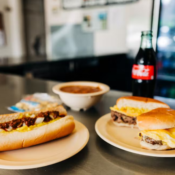 Photo of a egg burger, hot dog, chili and a coke at a Texas Inn diner